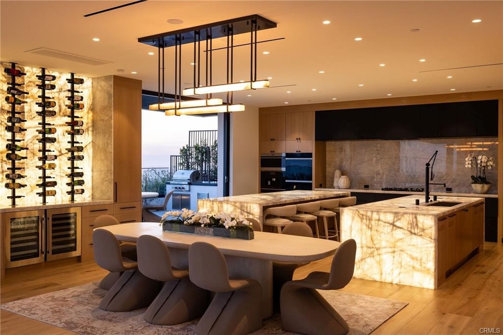 Luxury kitchen and dining room with marble island and ocean views