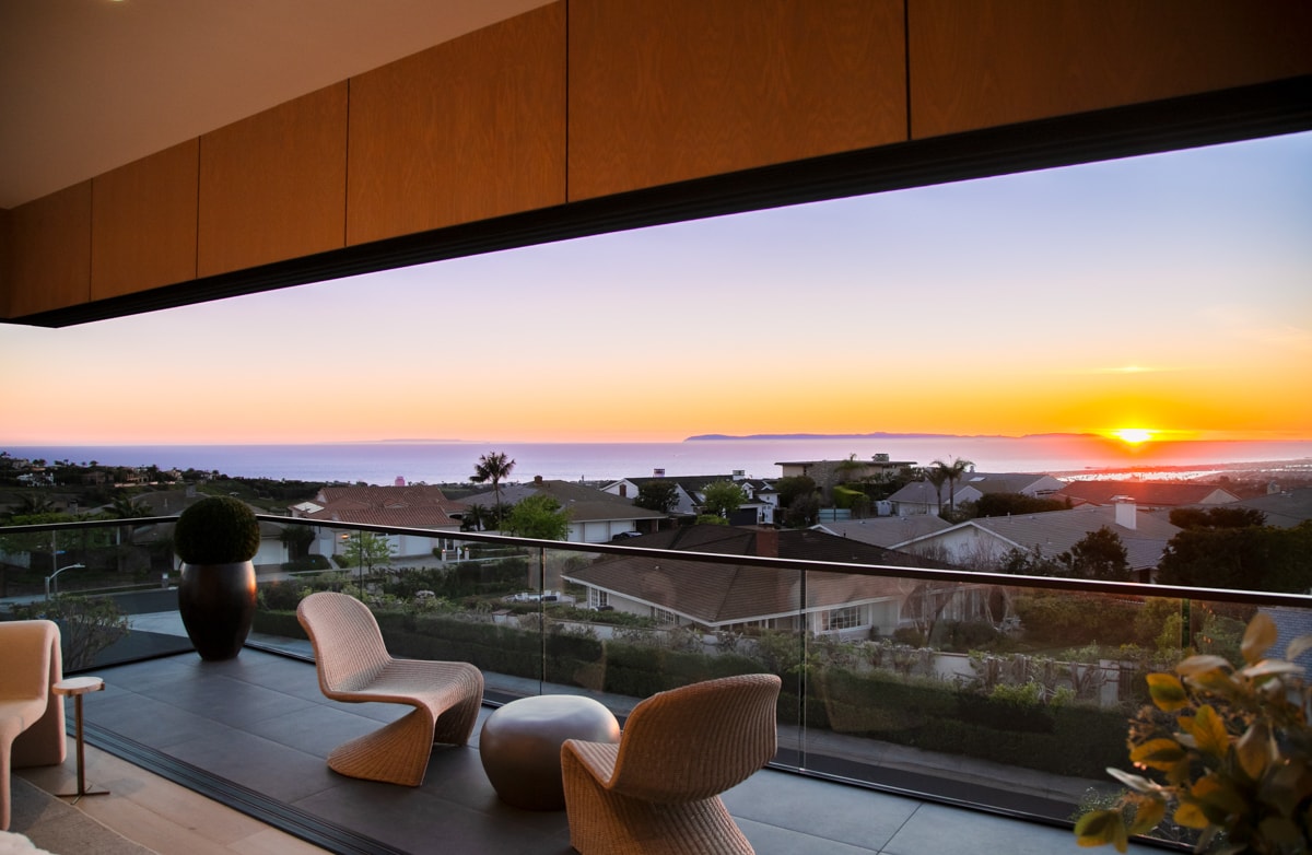 Balcony with sunset ocean views over Coastal Orange County