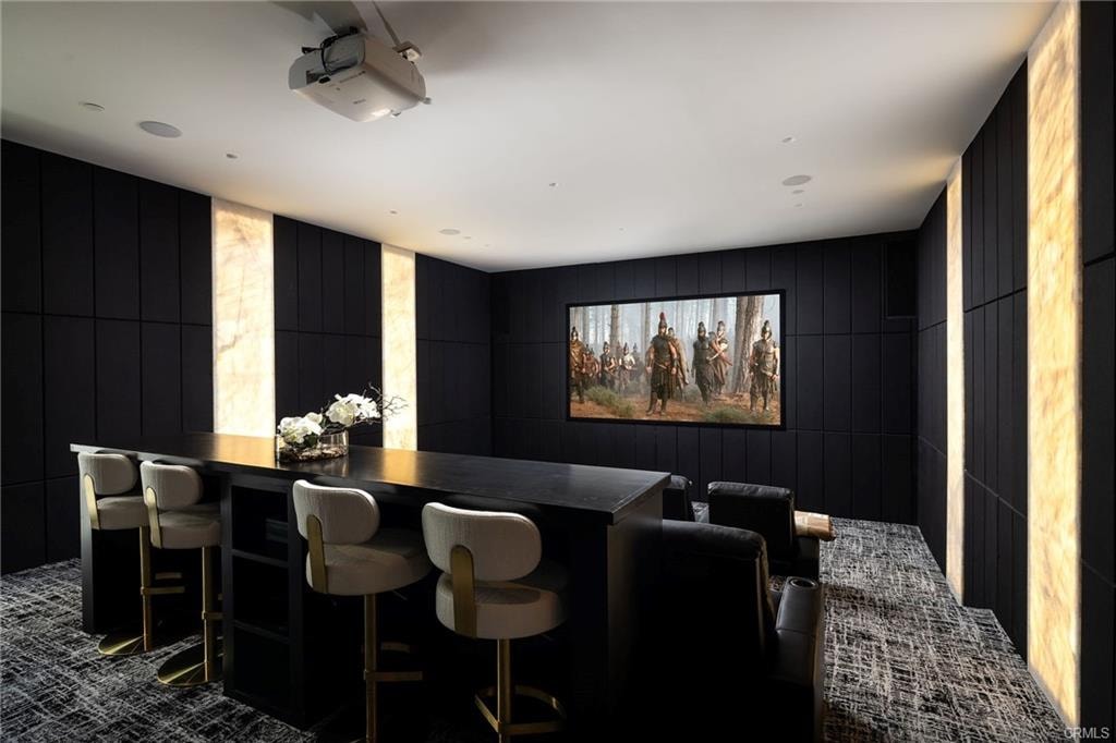 Modern home theater room with leather seating